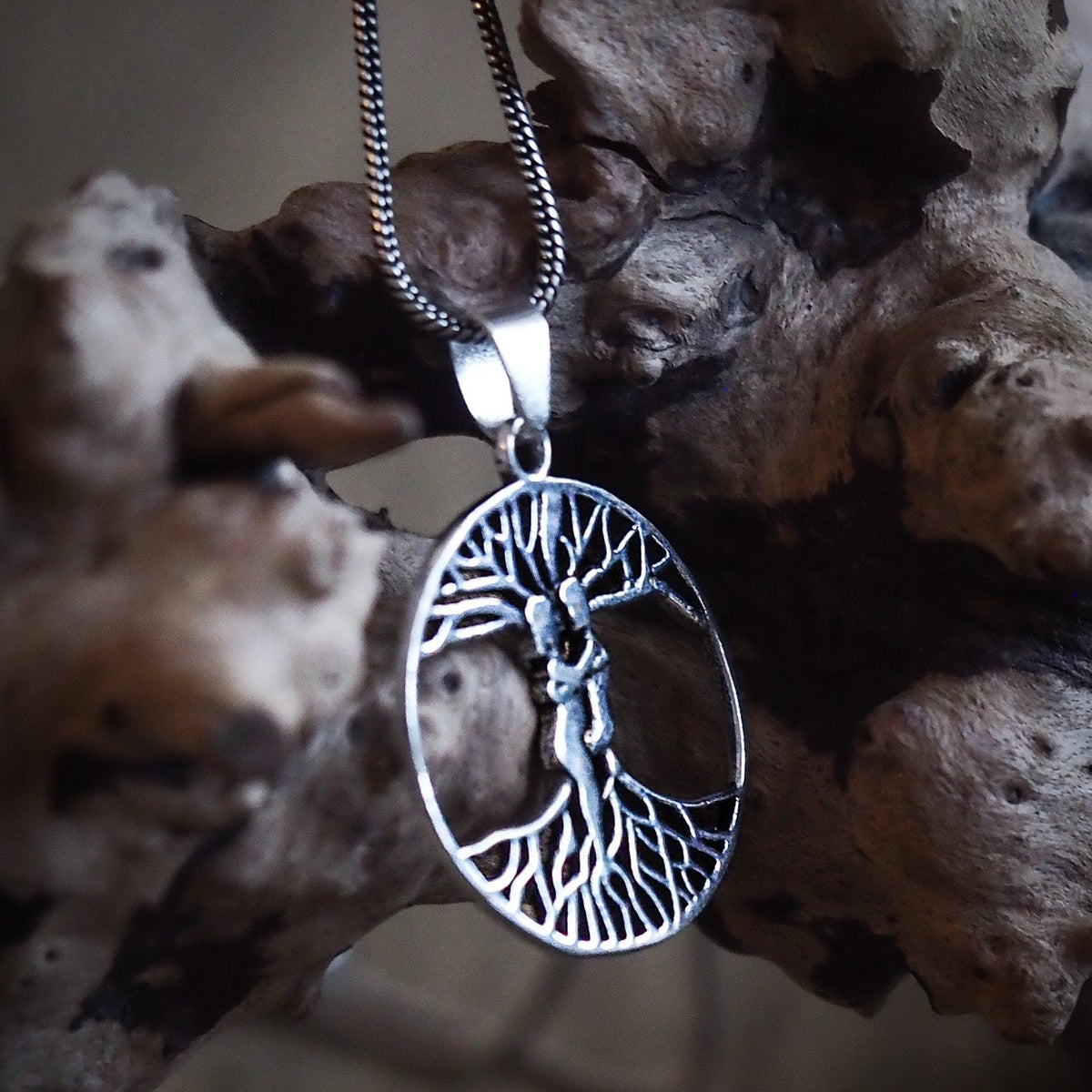 Ash and Embla on silver-plated chain.
