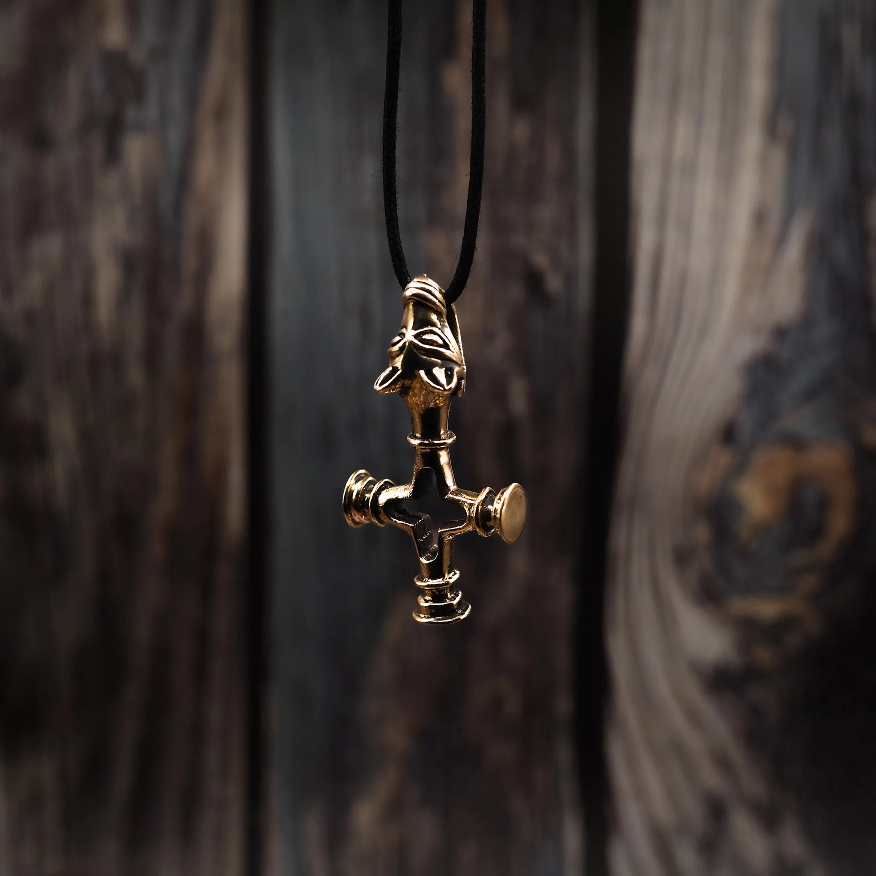 Wolf cross in brass