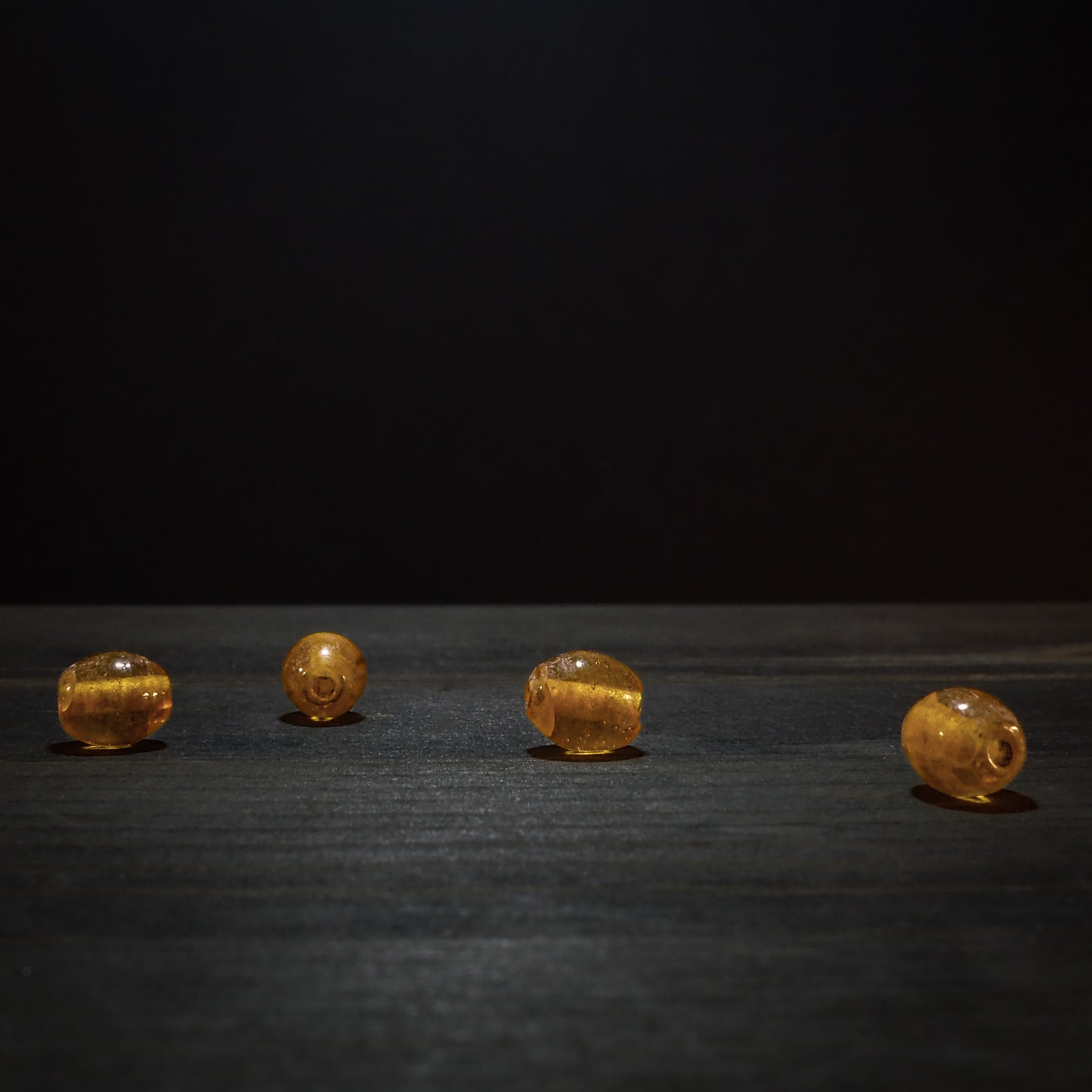 Orange bead in transparent glass