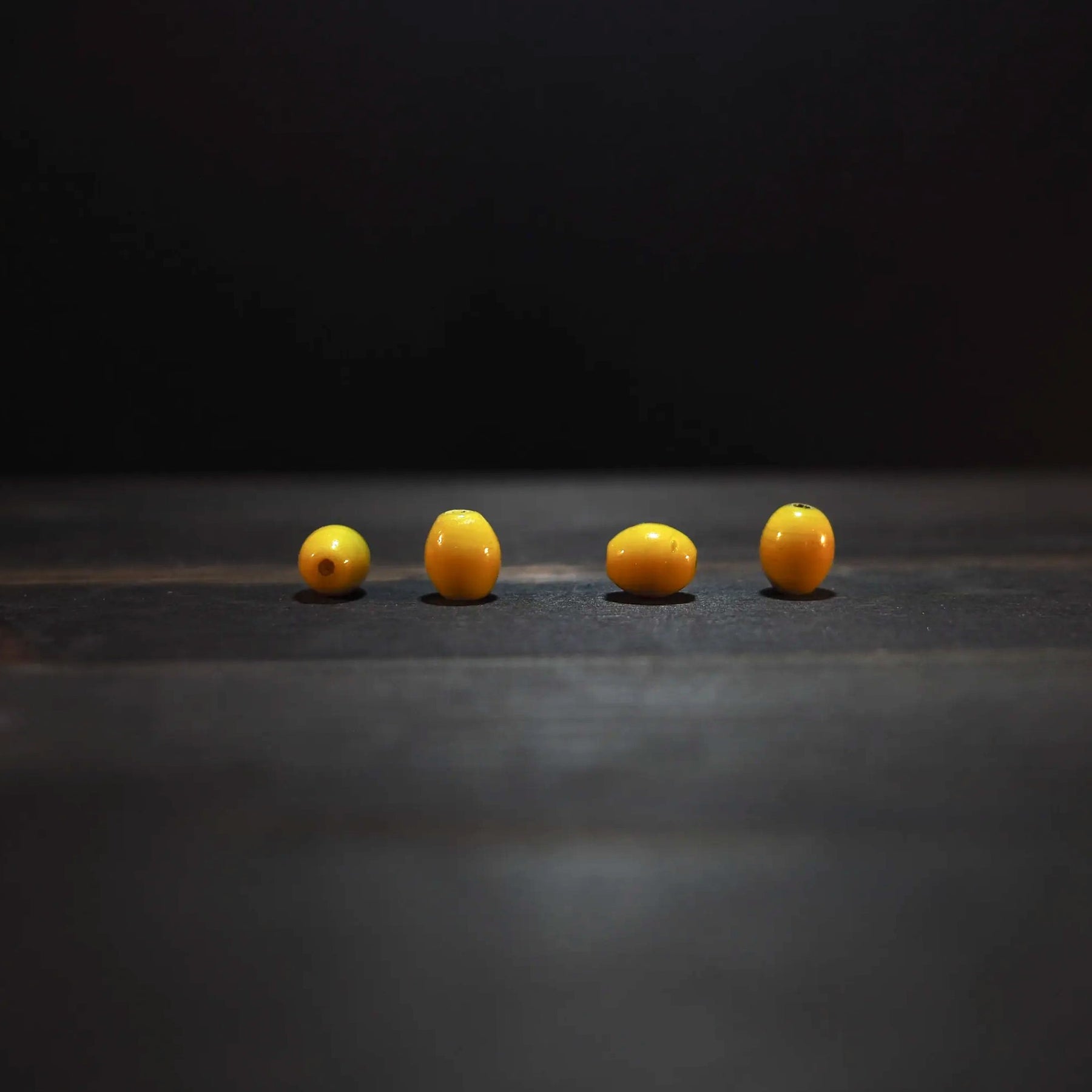Oval yellow glass bead