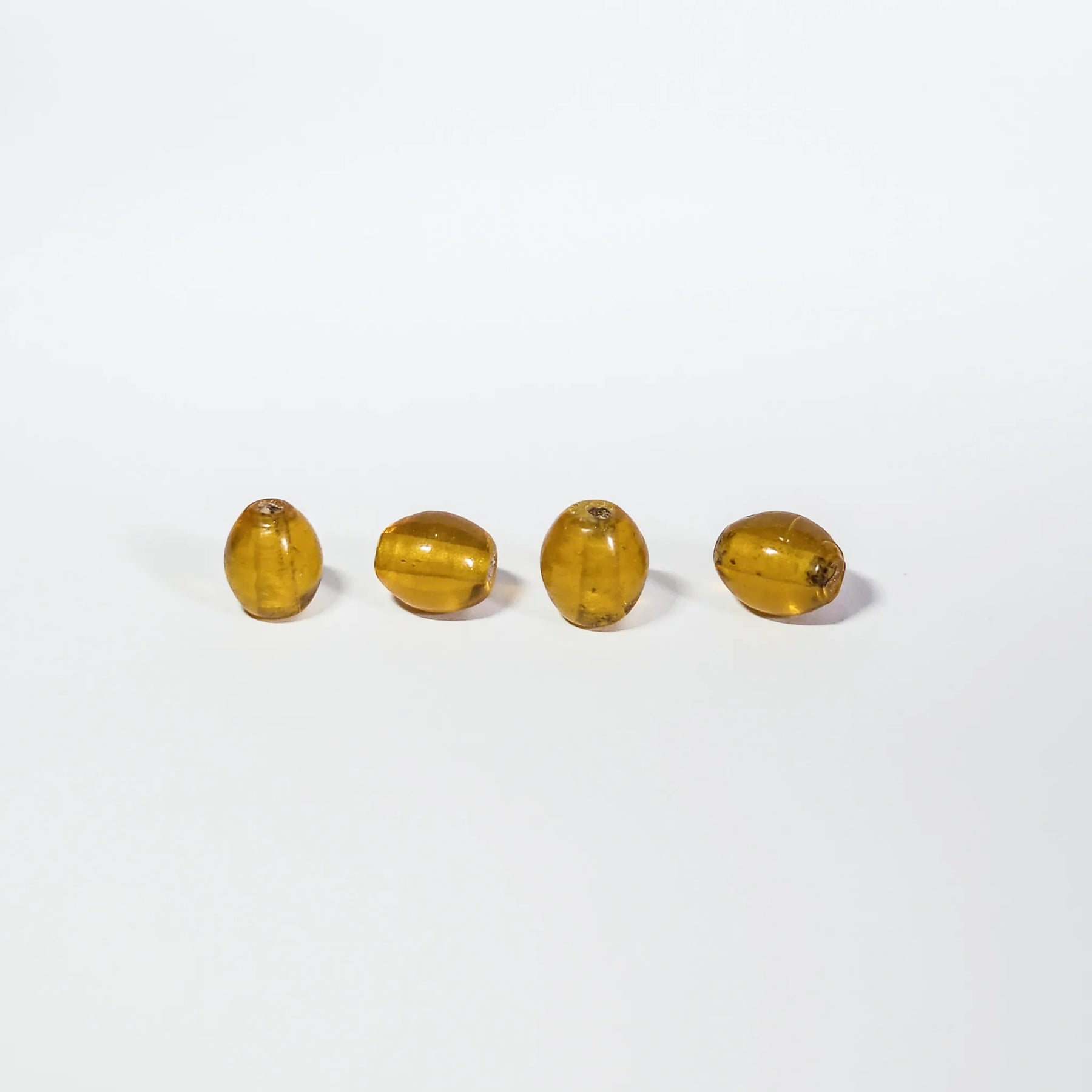 Orange bead in transparent glass