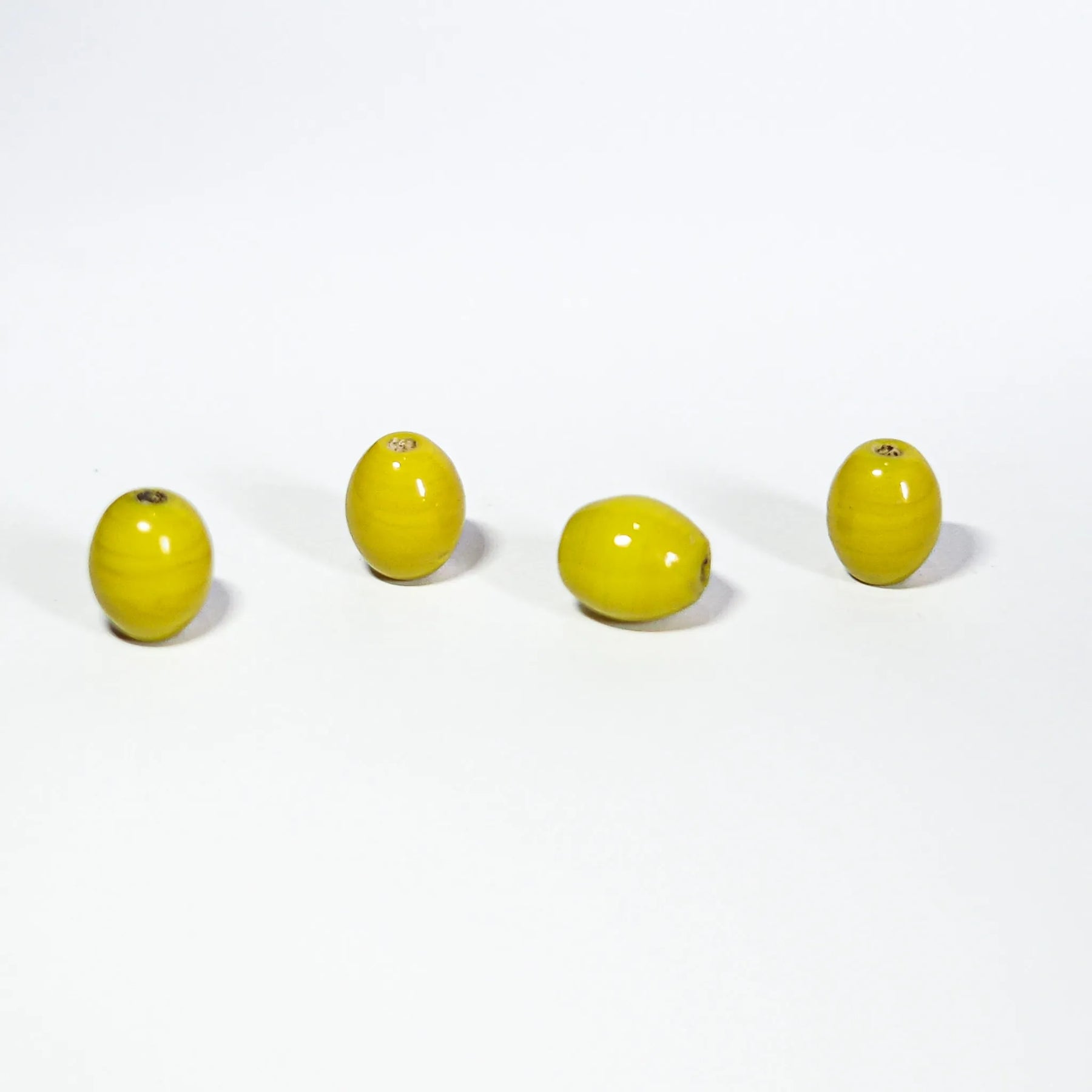 Oval yellow glass bead