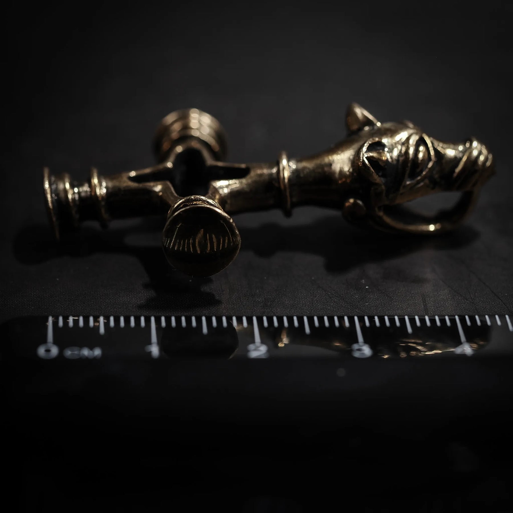 Wolf cross in brass