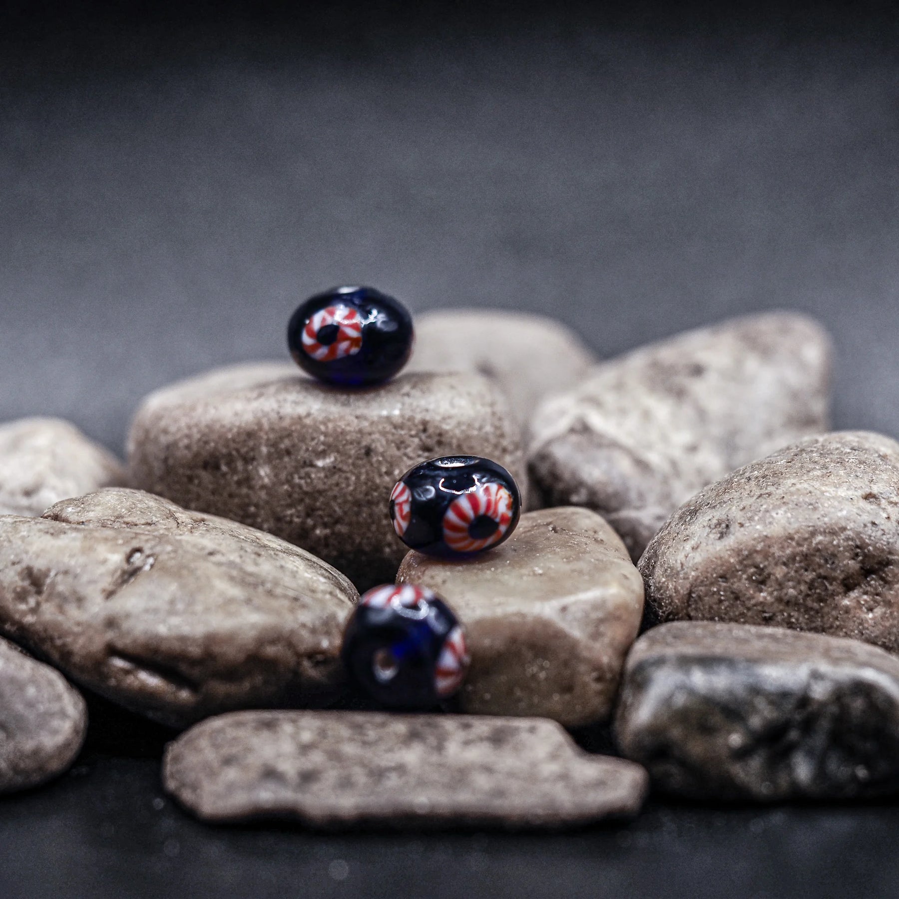 Blue glass bead with red-white eye