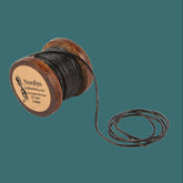 Svart lädertråd.Black leather thread.
