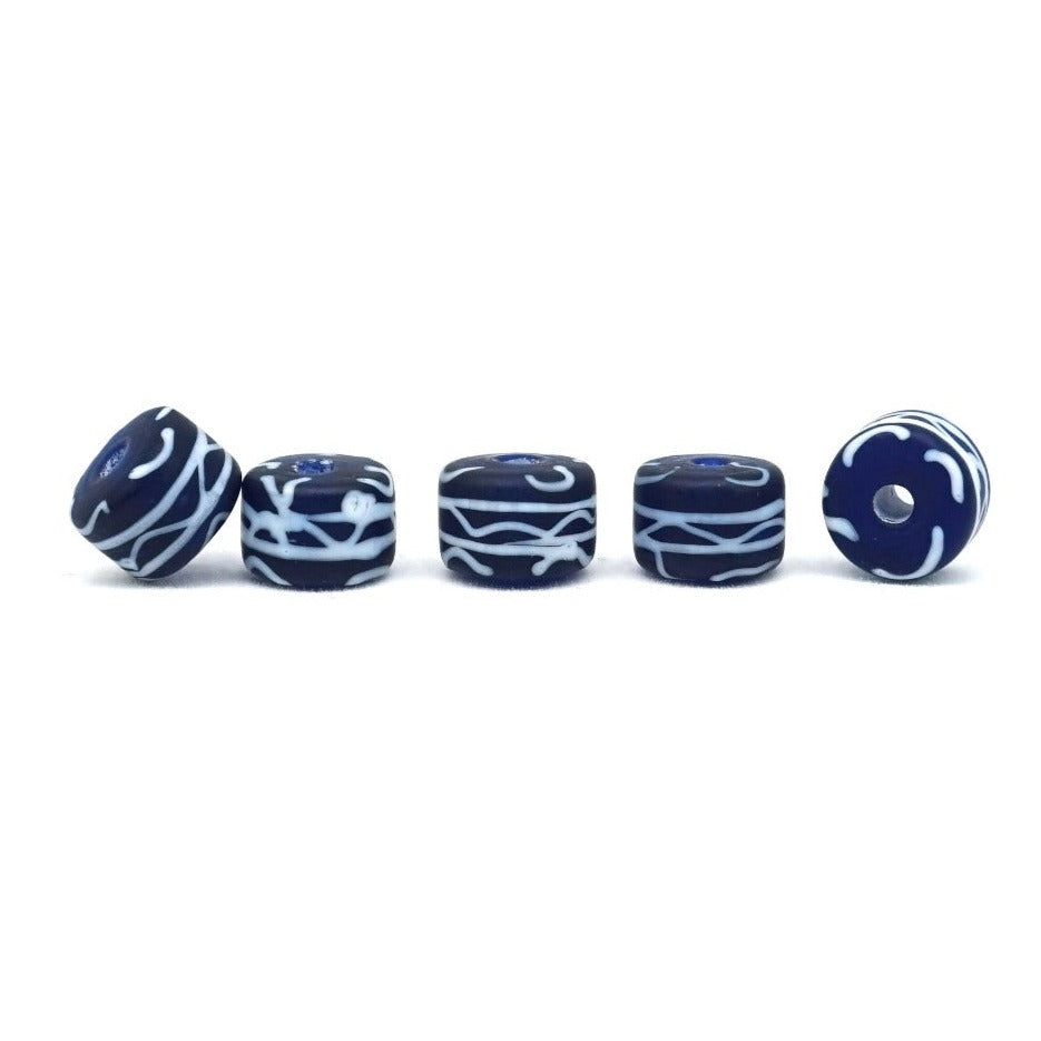 Blue glass bead with white decor, matt