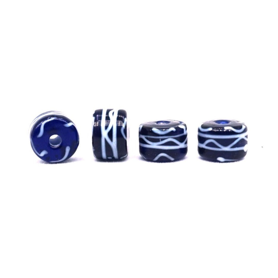 Blue glass bead with white decor, shiny