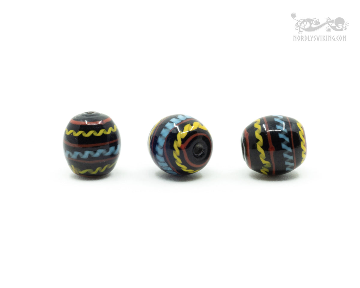 Black shiny glass bead with decoration