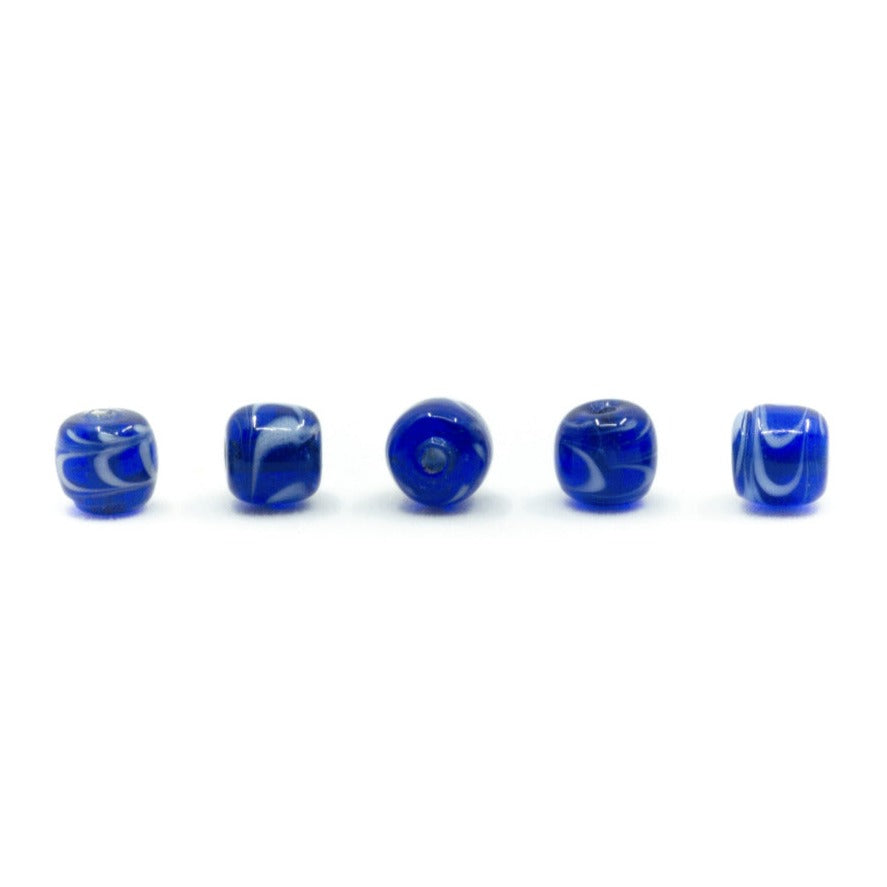 Blue shiny glass bead with decoration