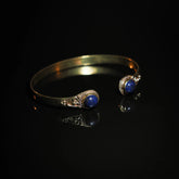 Double bracelet in brass with semi-precious stones.