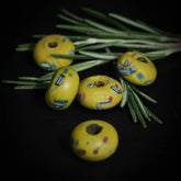 Gul glaspärla med färgglatt