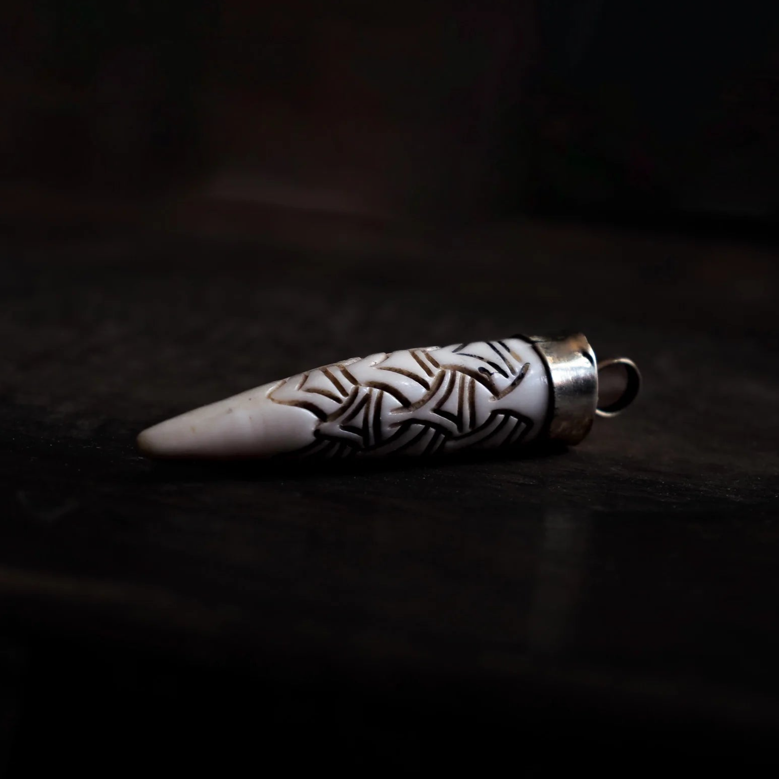 Carved bone pendant