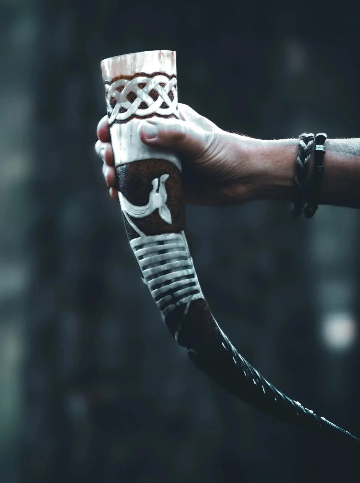 Drinking horn with carved Viking ship