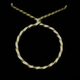 Wrought iron drinking horn stand with twisted details on black background, professional studio lighting showing craftsmanship quality