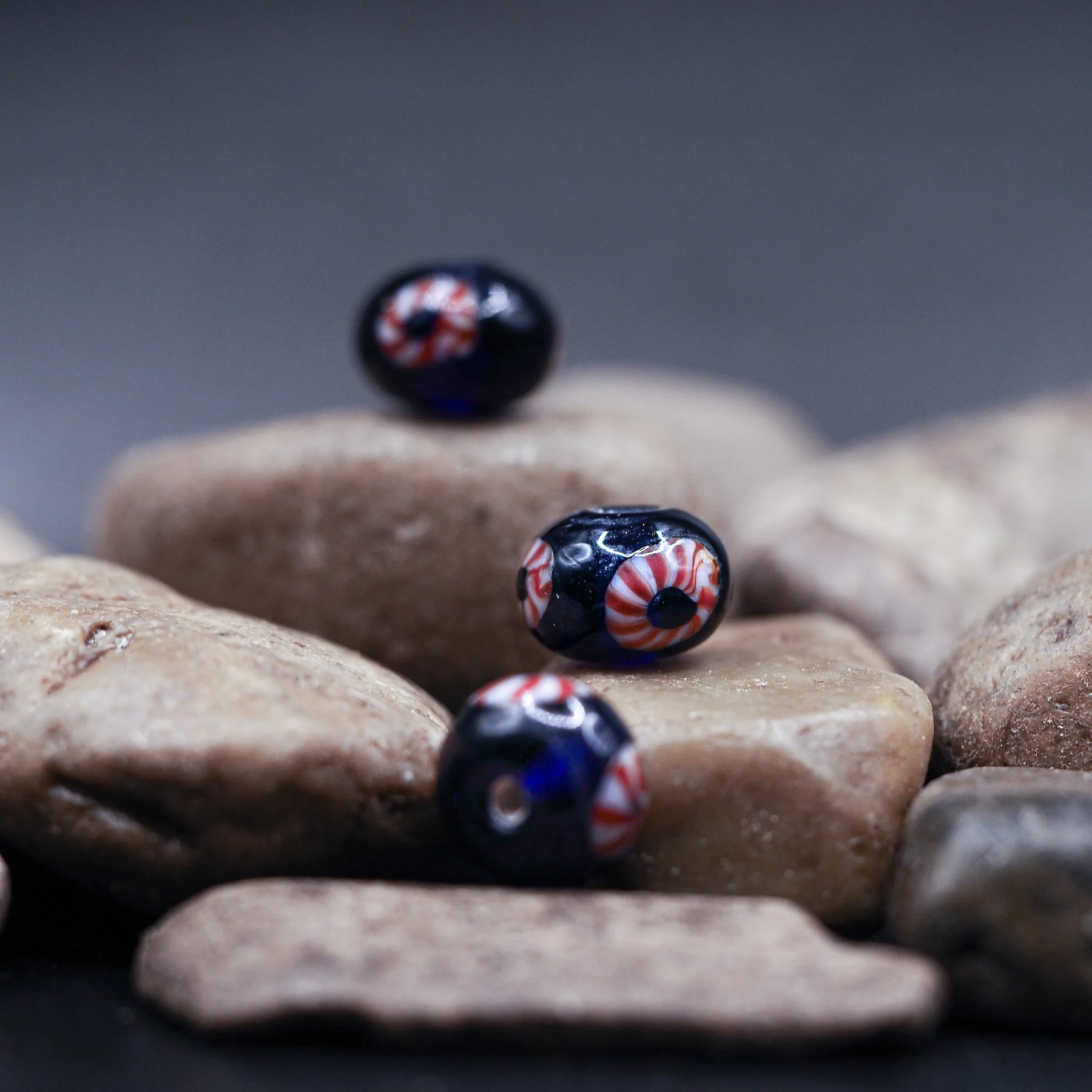 Blue glass bead with red-white eye