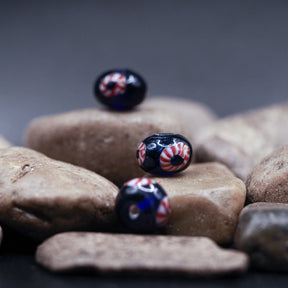 Blue glass bead with red-white eye