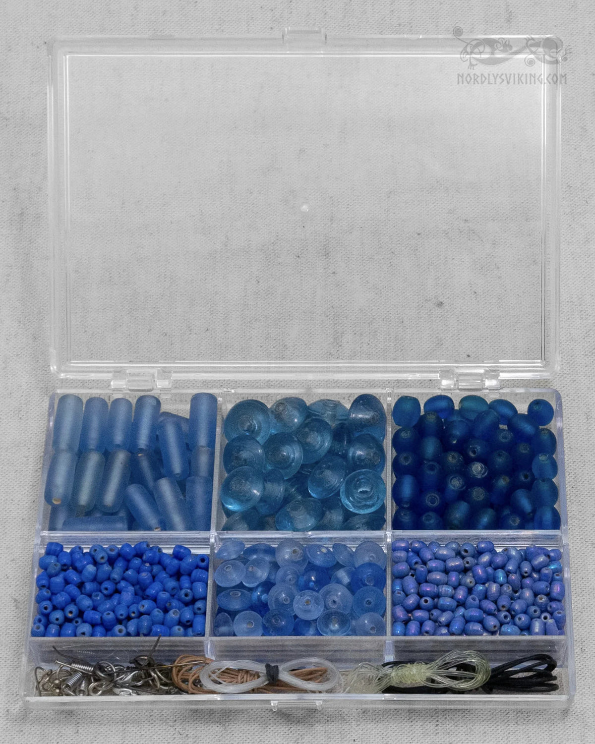 Bead box with blue beads – the box seen straight from above, all six compartments visible