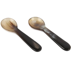 Salt and pepper bowls with spoon.