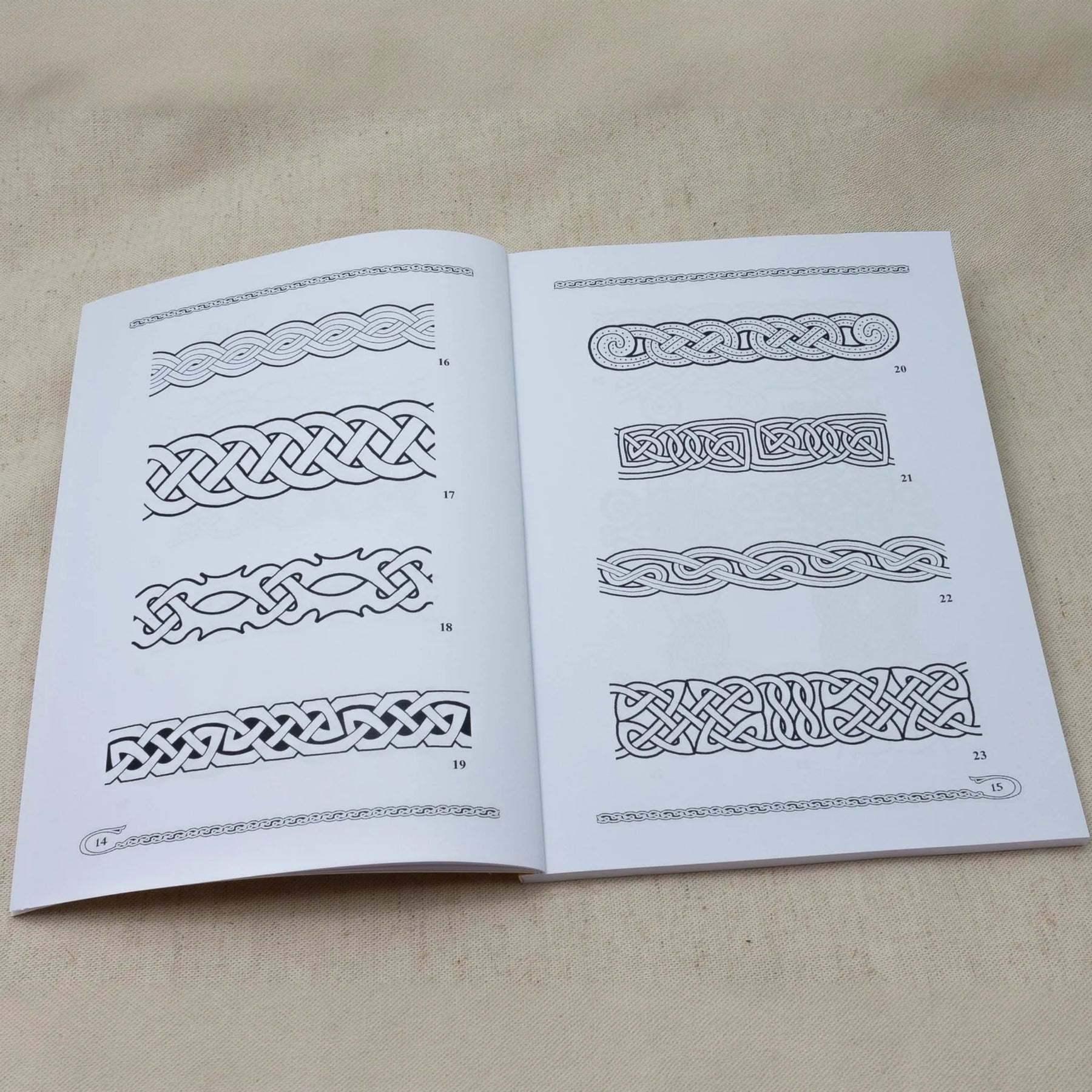 Pattern books vol. 1-4 – spread with braided border patterns from one of the books