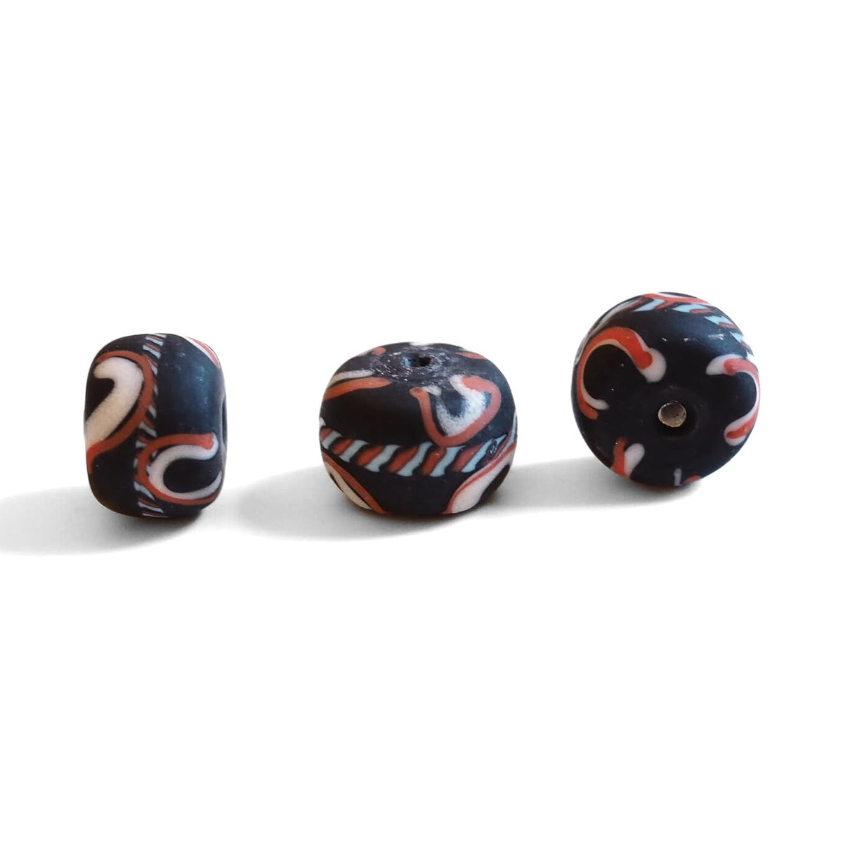 Large black glass bead with decoration, matt