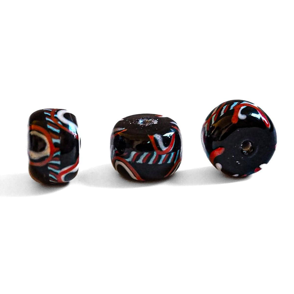 Large black glass bead with decoration, glossy