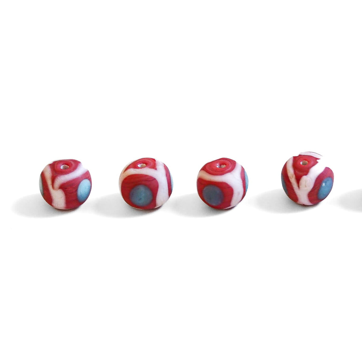 Red glass bead with decoration, matt