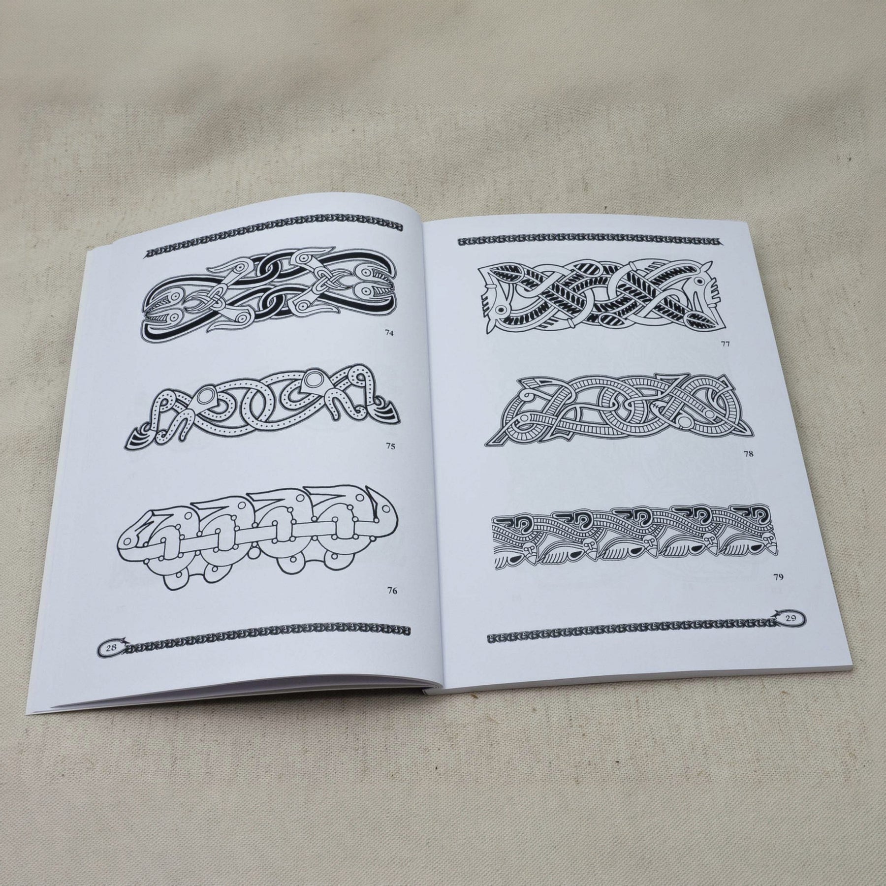Vendel and Dark Age Vol. 4 – spread with numbered animal interlace patterns, border 74–79