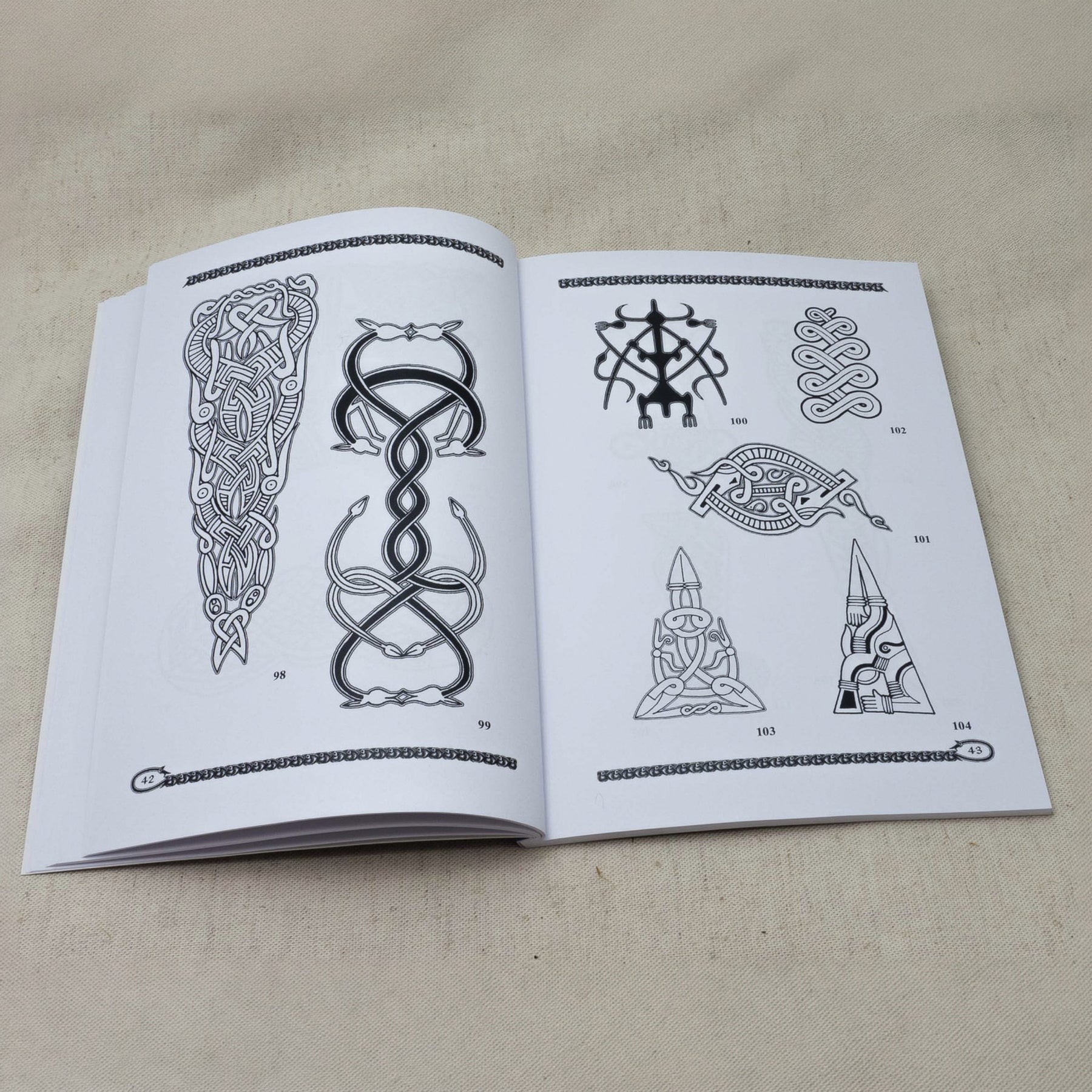 Vendel and Dark Age Vol. 4 – spread with numbered animal patterns, figure 98–104
