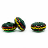 Green glossy glass bead with decor, Bodarp – three disc-shaped beads with a yellow zigzag pattern