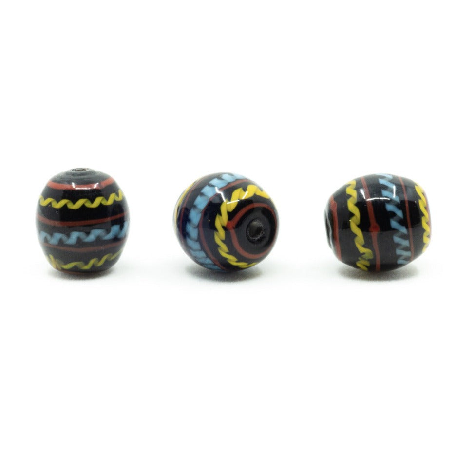 Black glass bead with decoration