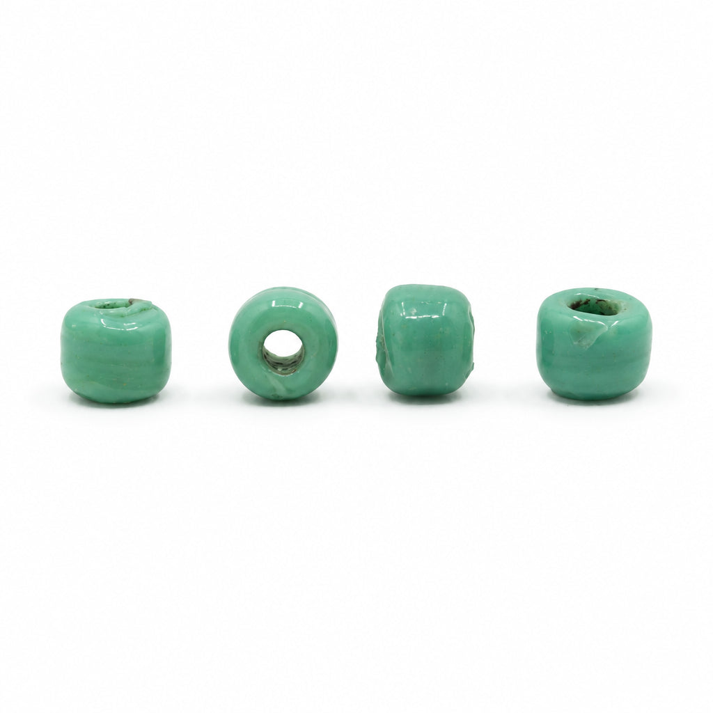 Green glass bead, Gotland – four mint-green, translucent barrel-shaped beads