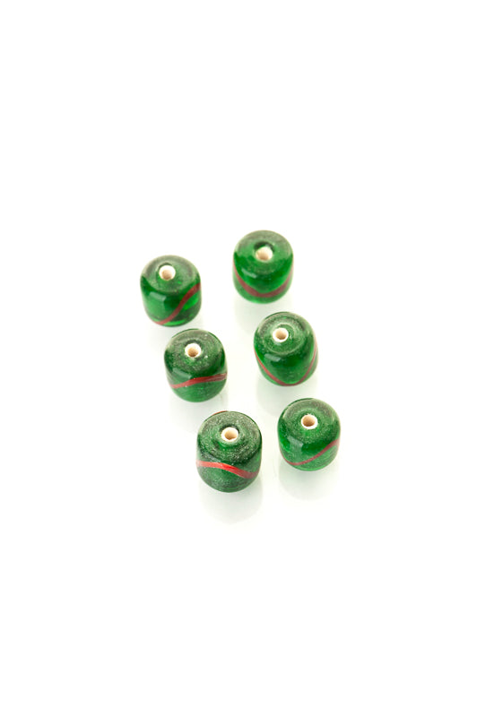 Green glass bead with decoration