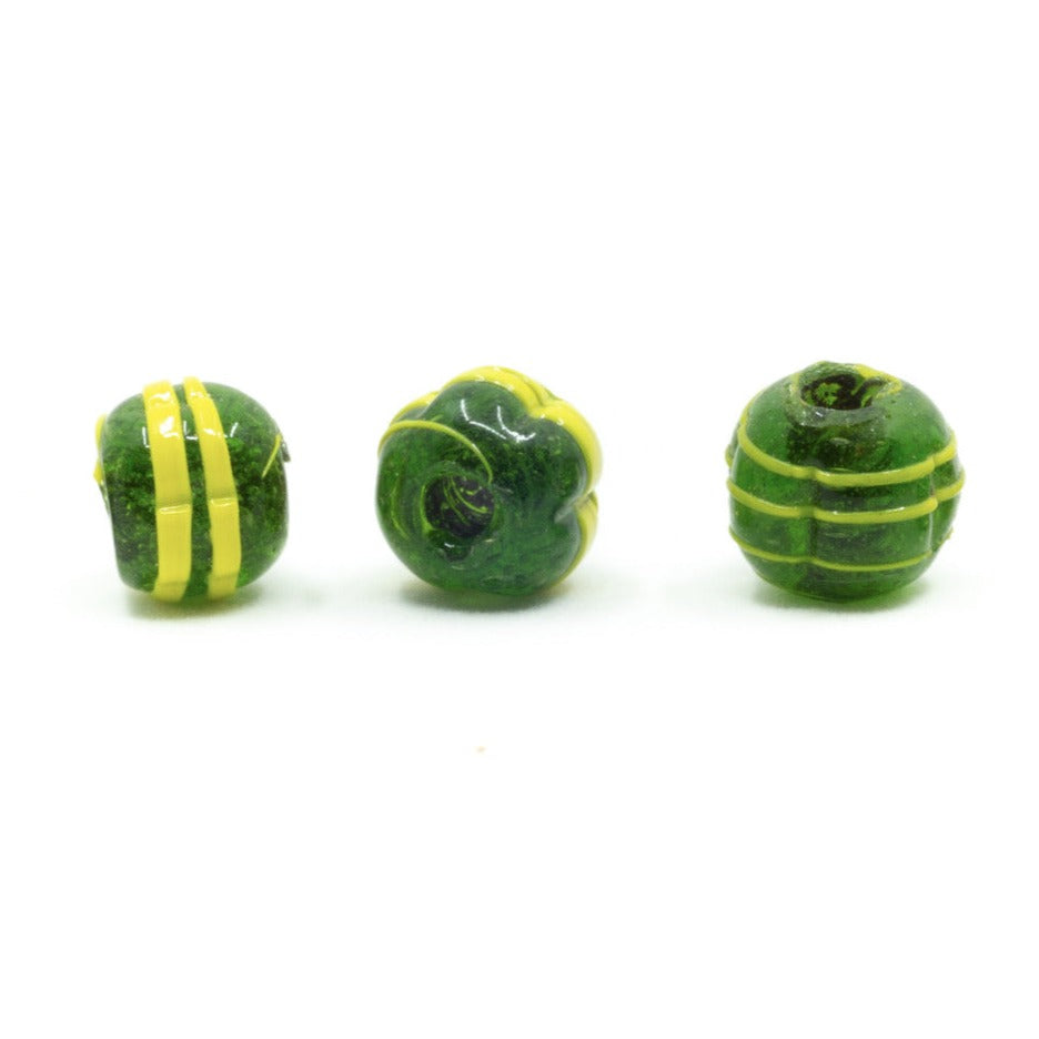 Dark green melon-shaped glass bead with yellow decoration
